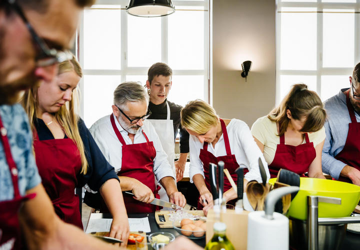 Group cooking lesson with professional chef